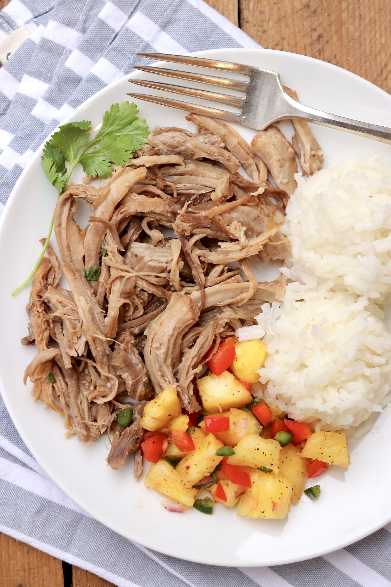This easy, melt-in-your-mouth Kalua Pork recipe comes with Instant Pot and slow cooker options PLUS everything you wanted to know about electric pressure cookers!